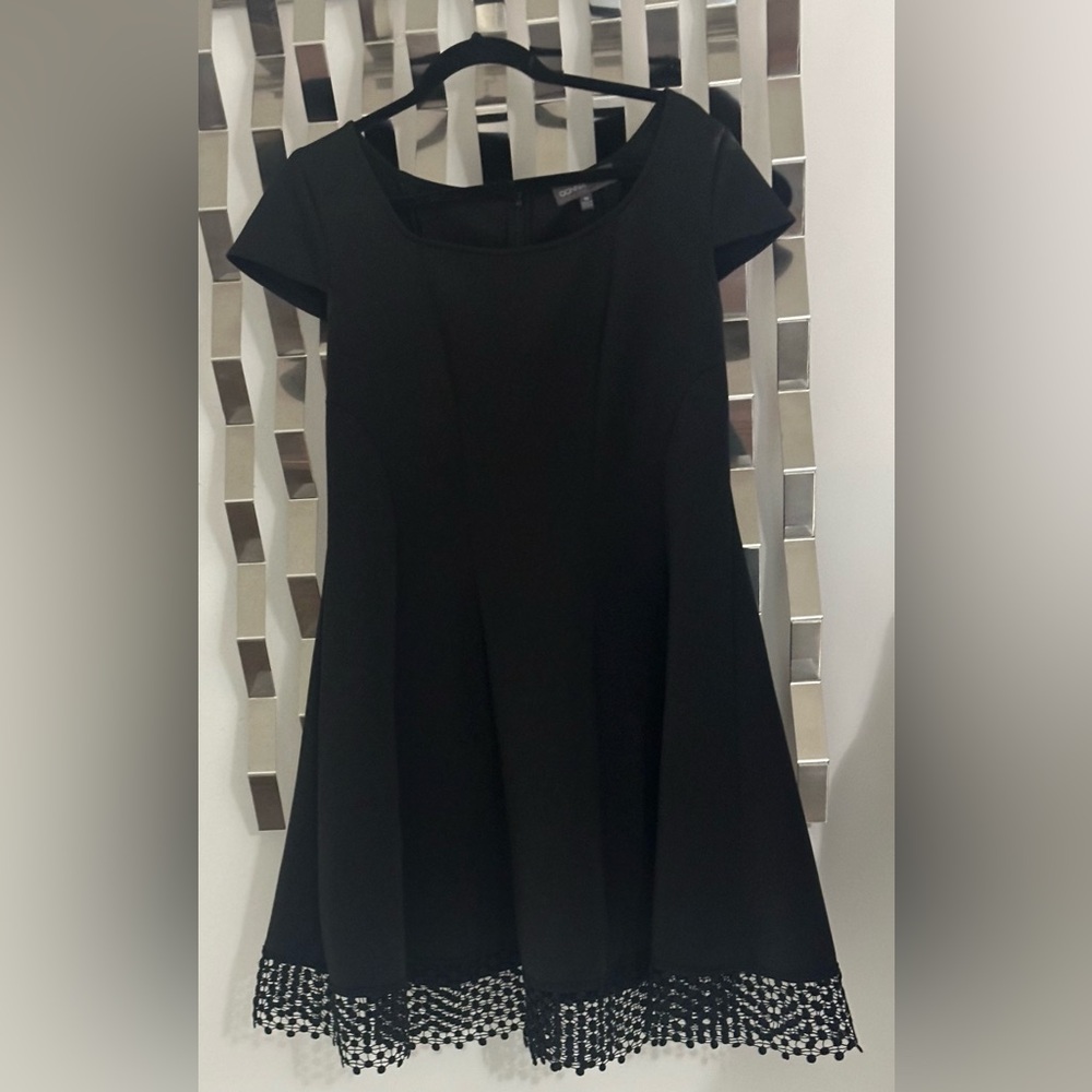 Elegant Black Dress with Lace Hem